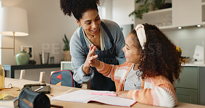 Buy stock photo Child, high five and house for education, learning and growth for future or knowledge. Mother, student and kitchen for help, studying and support or home school for development or coloring assessment