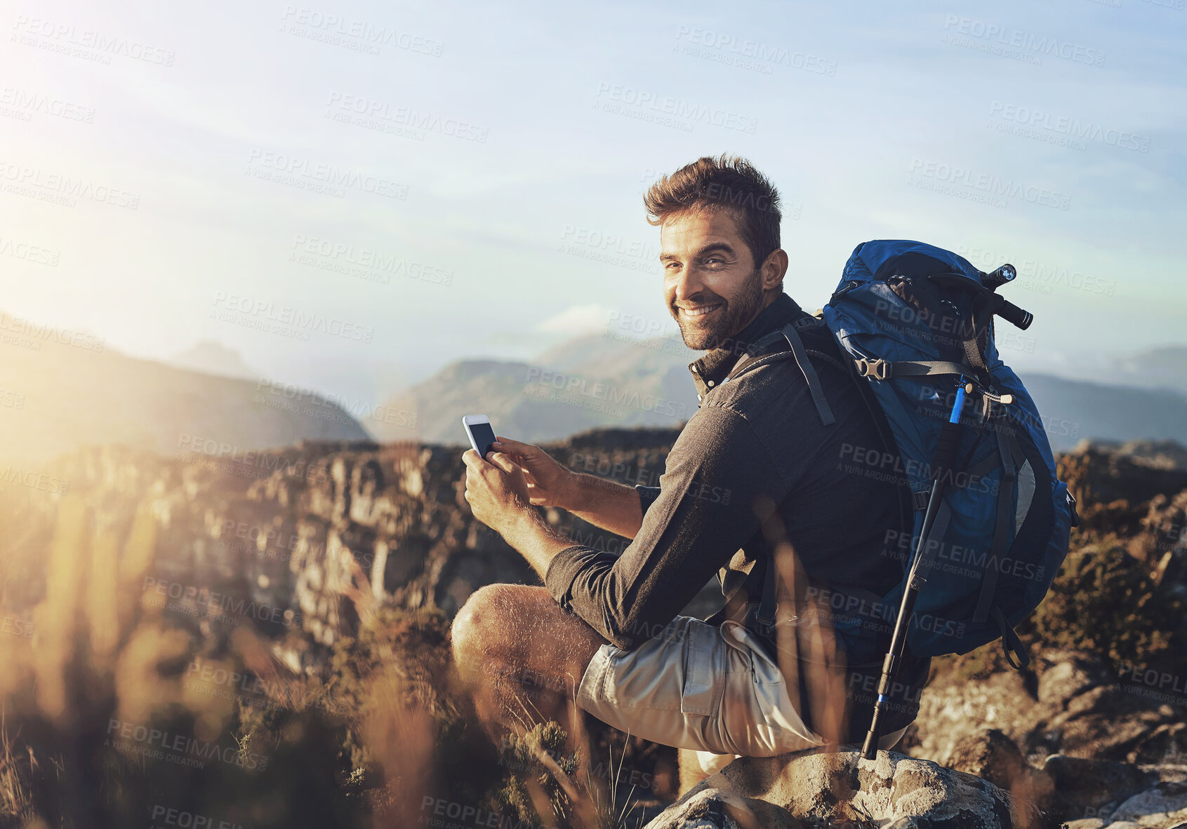 Buy stock photo Portrait, hiking and man on mountain with phone for geology career with digital nomad for travel. Nature, backpack and petrologist trekking with cellphone for environmental research in Australia.