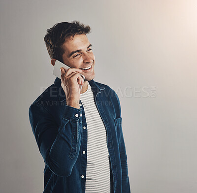 Buy stock photo Studio, man and phone call with laugh, funny news and comedy with contact by mockup. Creative worker, conversation and networking on smartphone with humor, chatting and connection by white background