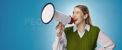 Buy stock photo Girl, megaphone and voice in studio for announcement, broadcast or join us with opportunity, news or mockup. Excited young person or gen z speaker in noise or attention on banner and blue background