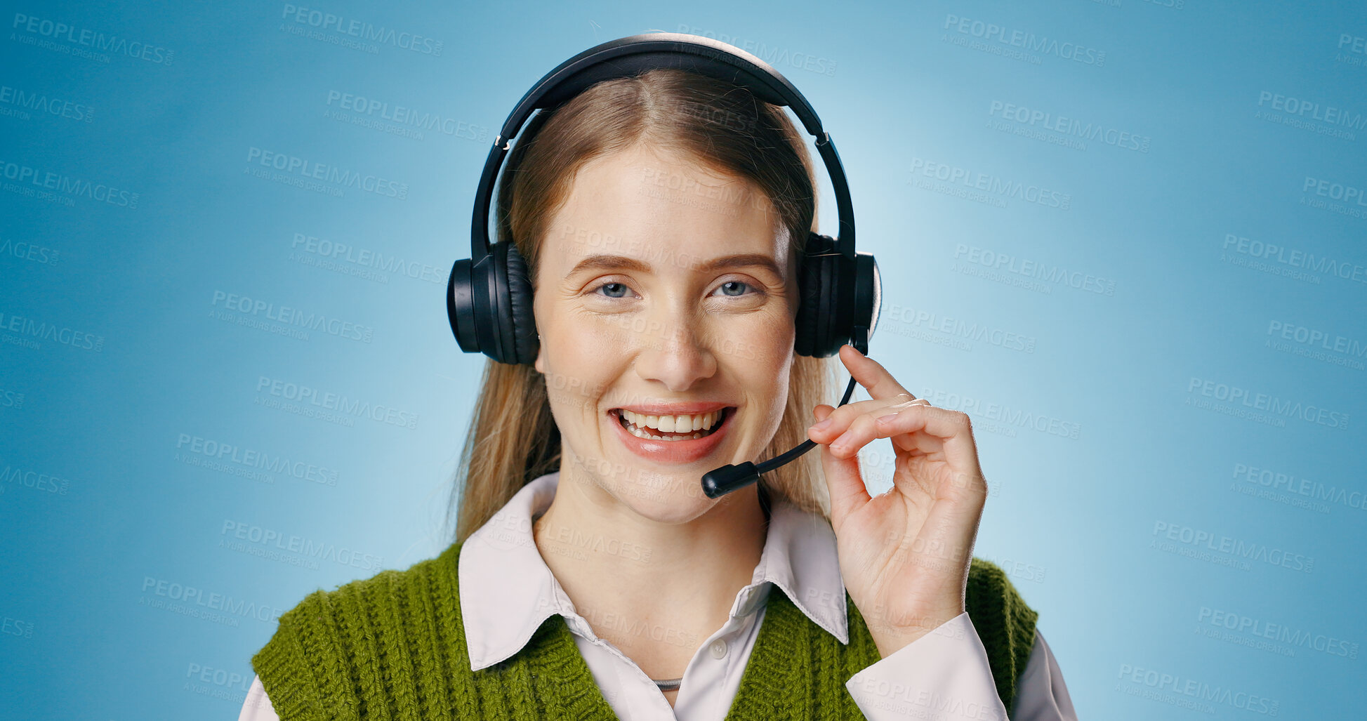 Buy stock photo Call center, portrait and woman in studio for support, communication or e learning advice. Virtual teacher, tutor or agent talking and smile in headphones for education or teaching on blue background