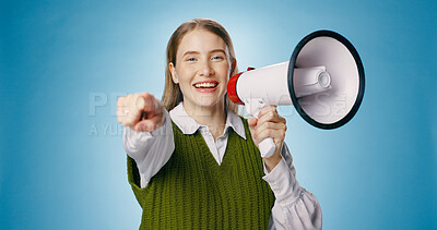 Buy stock photo Girl, megaphone and pointing you in studio announcement, broadcast or join us for opportunity. Portrait of person with winner choice for fashion competition, bonus or attention on blue background