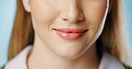 Skincare, woman and mouth in closeup for natural glow or shine and dermatology isolated in studio. Smile, lips and female person with facial treatment, beauty and luxury spa cosmetics for wellness