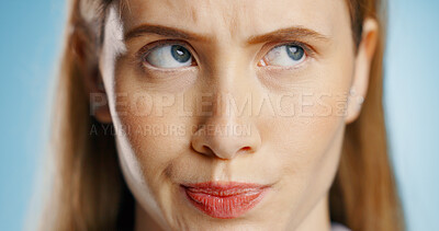 Buy stock photo Thinking, idea and face of woman in studio for decision, problem solving or planning future on blue background. Closeup, question and model in thought for solution, career opportunity or inspiration