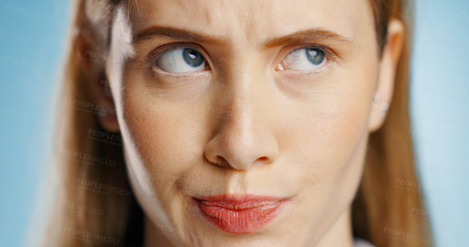 Buy stock photo Thinking, idea and face of woman in studio for decision, problem solving or planning future on blue background. Closeup, question and model in thought for solution, career opportunity or inspiration