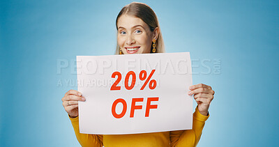 Buy stock photo Poster, discount and portrait of woman on blue background for news, announcement and information. Shopping, advertising and happy person with billboard for price sale, deal and bargain in studio