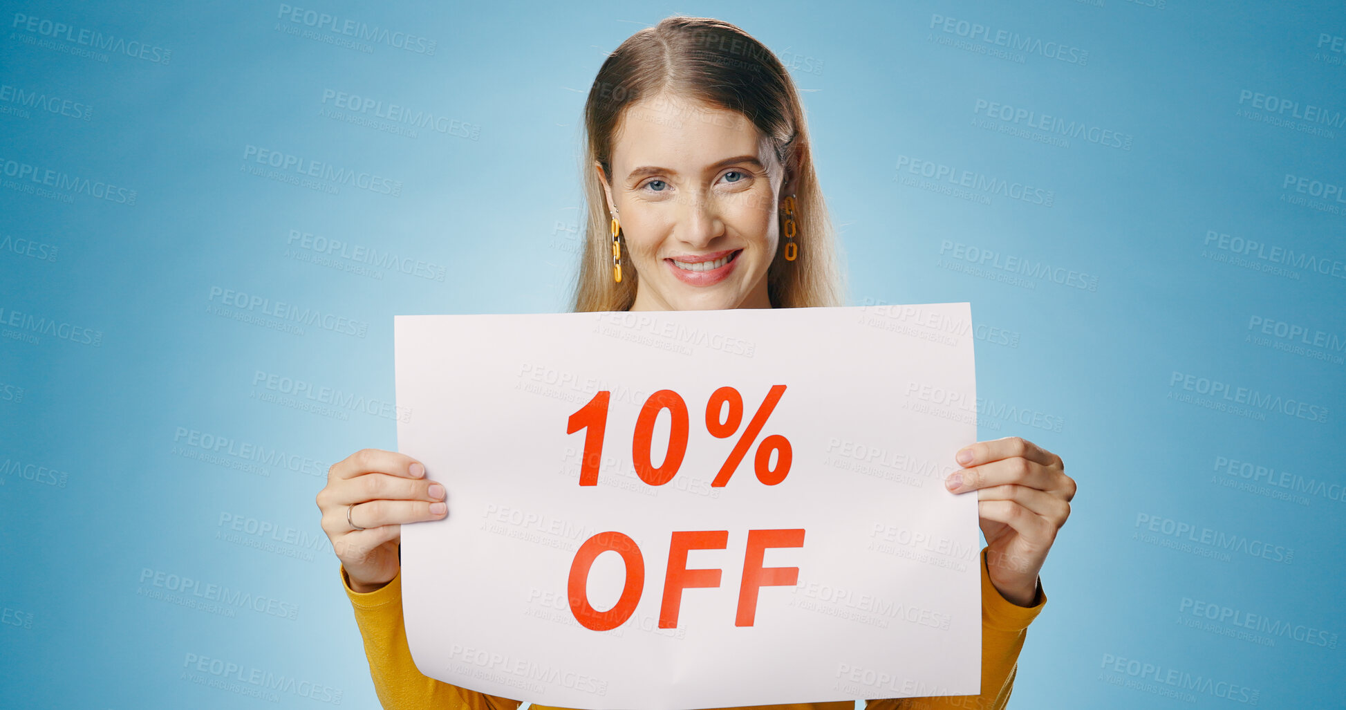 Buy stock photo Billboard, sale and portrait of woman on blue background for news, announcement and information. Shopping, advertising and happy person with poster for price discount, deal and bargain in studio