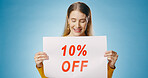 Poster, sale and woman on blue background with banner for news, announcement and information. Shopping, advertising and happy person with billboard sign for price discount, deal and bargain in studio