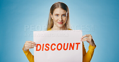 Buy stock photo Poster, discount and portrait of woman on blue background for news, announcement and information. Shopping, advertising and happy person with sign or banner for retail sale, deal or bargain in studio