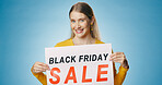 Banner, sale and portrait of woman on blue background for news, announcement and promotion. Shopping, advertising and happy person with poster for black Friday discount, deal and bargain in studio