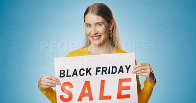 Buy stock photo Banner, sale and portrait of woman on blue background for news, announcement and promotion. Shopping, advertising and happy person with poster for black Friday discount, deal and bargain in studio