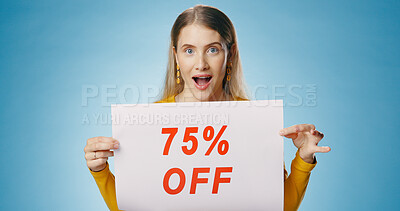 Buy stock photo Shock, sale and portrait of woman with poster on blue background for news, announcement and advertising. Shopping, wow and happy person with sign for price discount, deal and bargain in studio