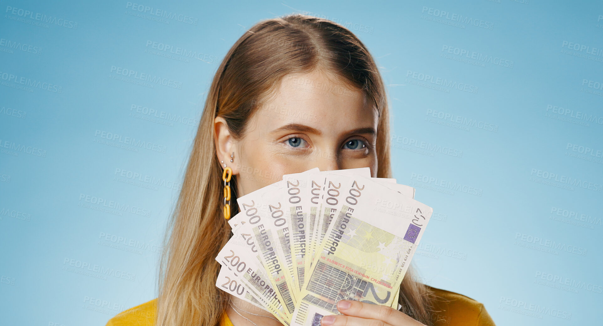 Buy stock photo Cash, portrait and woman cover face in studio with money fan for finance, loan or savings on blue background. Sale of winner or person hide with budget secret, lottery or gambling for investment