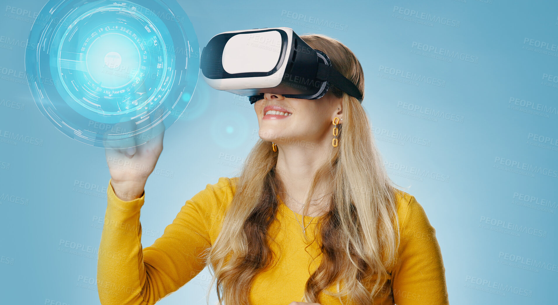 Buy stock photo VR, woman and button in studio for metaverse, digital and video game on blue background. Technology, virtual and streaming for gamer person, hobby and internet for 3d augmented reality experience