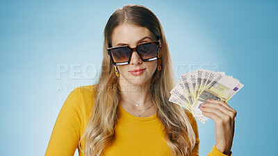 Buy stock photo Sunglasses, money and portrait of woman on blue background for winning bonus, competition and lottery. Savings, finance and person with cash for promotion, profit success and payment in studio