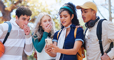 Buy stock photo Young students, shock and bad news with phone at park for campus results, fail or feedback. Group of people in disbelief for disapproval on scholarship, alert or notification on mobile smartphone