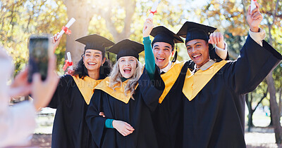 Buy stock photo Happy friends, graduation and celebration with photography for memory, certficate or diploma in nature. Group of young and excited graduates or students with smile in picture, moment or qualification