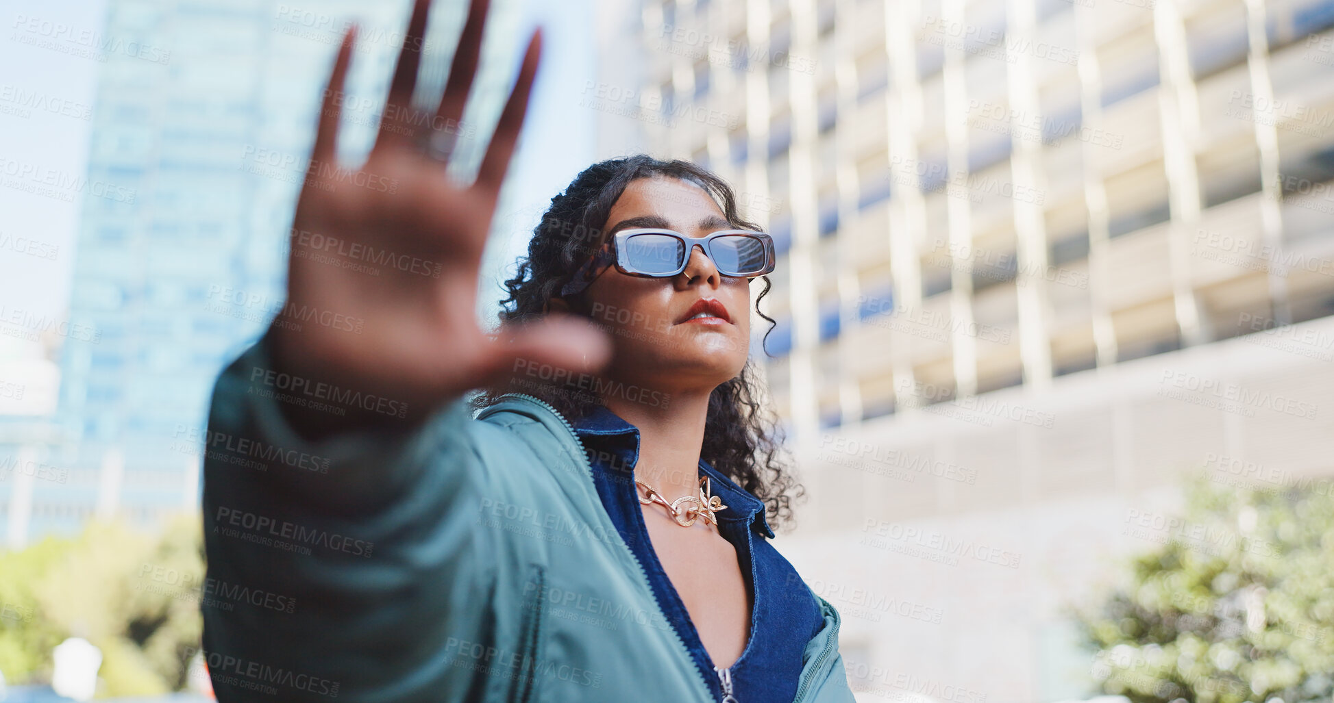 Buy stock photo Woman, hand frame and edgy with sunglasses in city for trendy style, designer brand or streetwear. Luxury fashion, aesthetic and person for confidence, eyewear or cool accessories in urban town