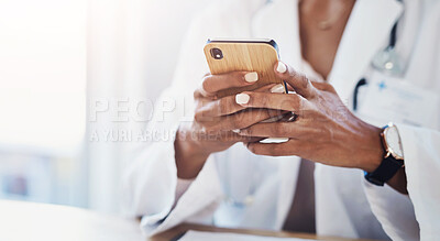 Buy stock photo Hospital, office and hand of doctor with phone for medical research, communication and email to patient. Healthcare, professional and person with tech at desk for insurance, information or telehealth