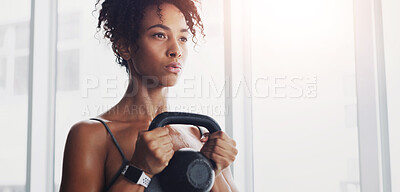 Buy stock photo African woman, kettlebell and training at gym with thinking for workout, wellness and muscle development. Person, bodybuilder and weightlifting for change, exercise or body transformation with health