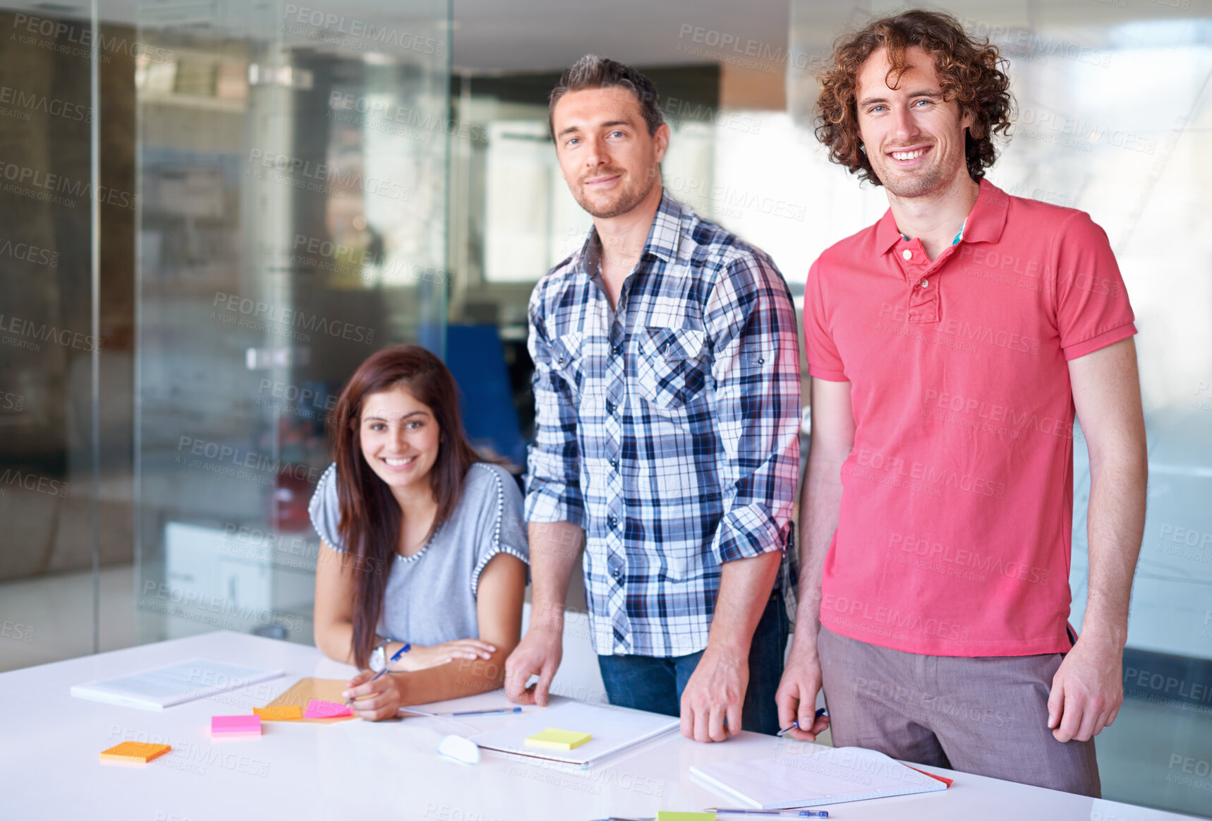 Buy stock photo Portrait, smile and team of business people at table in meeting together, cooperation or collaboration in startup. Happy face, creative group and designers at desk, coworking and solidarity in office