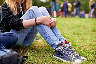 Buy stock photo Legs, shoes and person on grass closeup outdoor at event, festival or social gathering in green nature. Party, ground or field with casual woman sitting in forest, park or woods for entertainment
