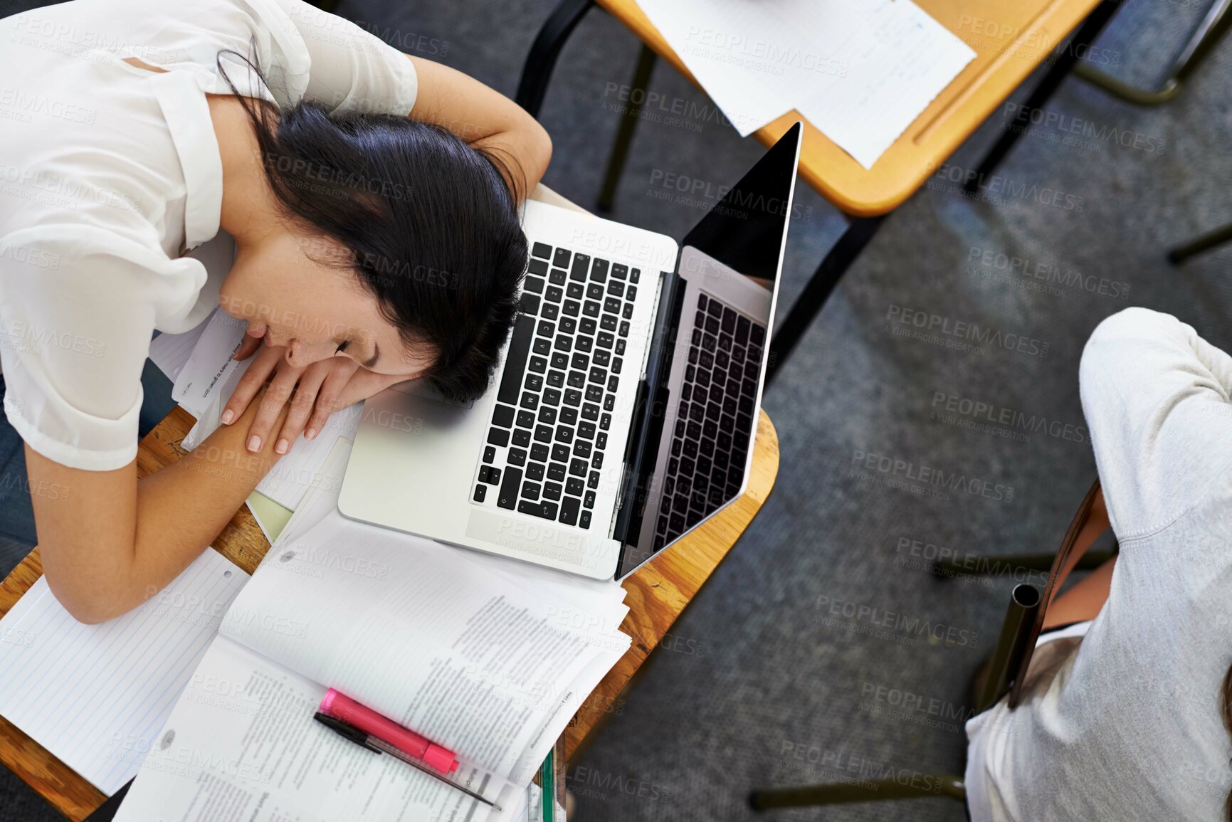 Buy stock photo Laptop, education and woman student sleeping on desk in class with exhaustion or fatigue from above. Computer, burnout or tired and young person asleep in school classroom with books for study