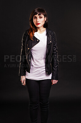 Buy stock photo Portrait, tattoo and gothic woman in a leather jacket on a black background for edgy style in studio. Dark, unique and cool female punk model with ink on skin for art, fashion or creative expression 