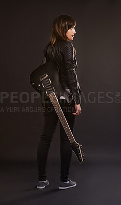 Buy stock photo Woman, guitar and fashion for musical instrument, sound and trendy for retro and style on dark background. Young person, musician and artist for creative, funky and edgy for bold with leather jacket