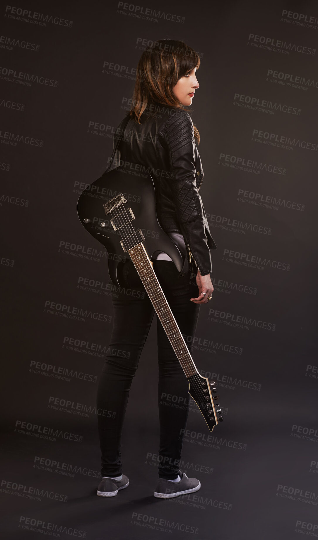 Buy stock photo Woman, guitar and fashion for musical instrument, sound and trendy for retro and style on dark background. Young person, musician and artist for creative, funky and edgy for bold with leather jacket