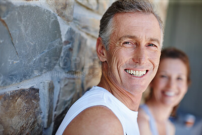 Buy stock photo Exercise, portrait and smile with mature couple outdoor on brick wall for running or training together. Fitness, cardio and face of man with woman at start of daily workout routine to improve health