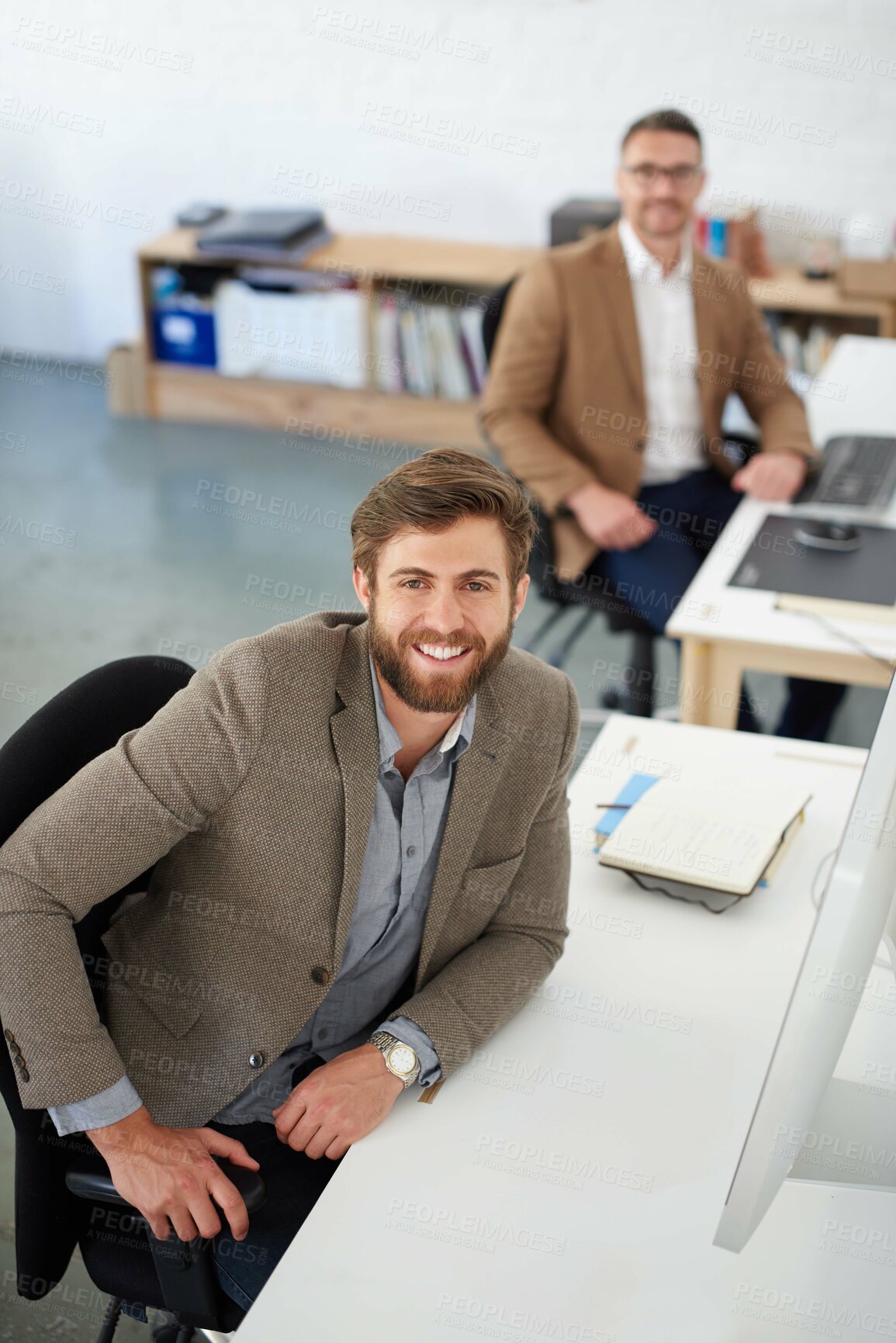 Buy stock photo Businessman, smile and portrait in office, table and coworking of colleagues, computer and together. Above, working and entrepreneur in company, journalist and confidence in startup and creative