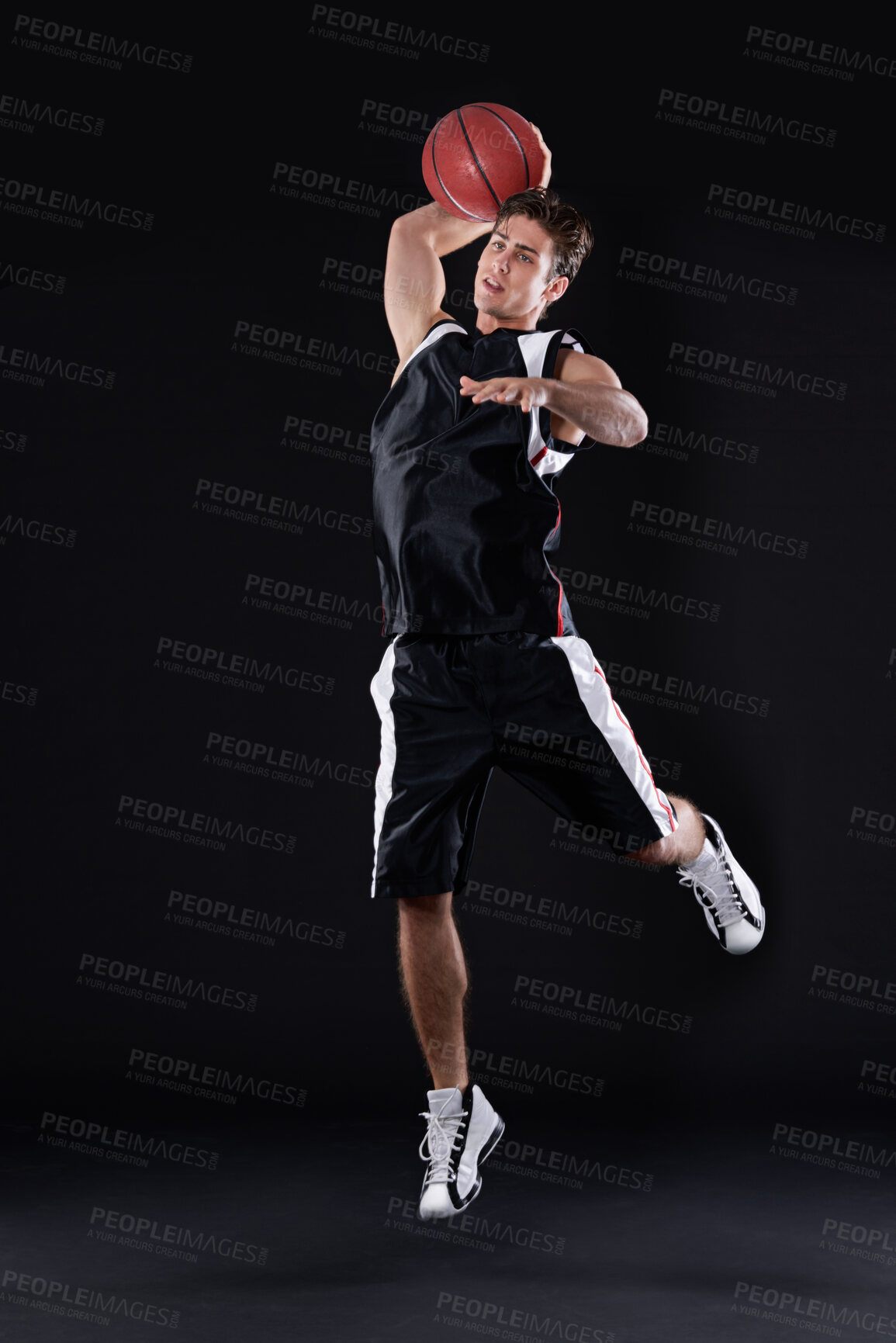 Buy stock photo Basketball, shooting and man jump in studio for exercise, workout or healthy body fitness isolated on black background. Sports, player and athlete throw ball or competition, game or mockup space