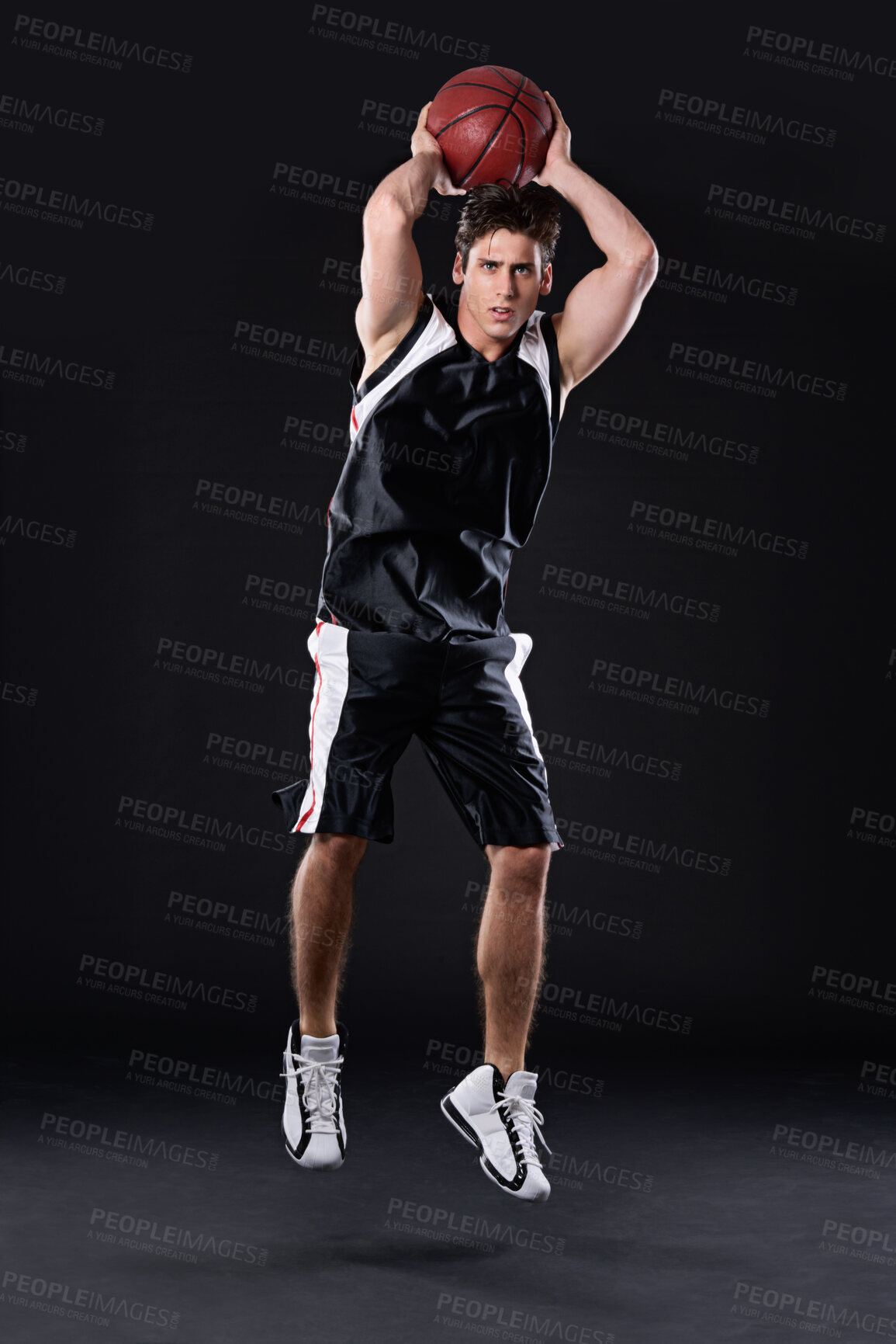 Buy stock photo Shooting, basketball and man jump for training, energy and healthy body fitness in studio. Sports, player and athlete throw ball for competition, game and mockup space  isolated on black background