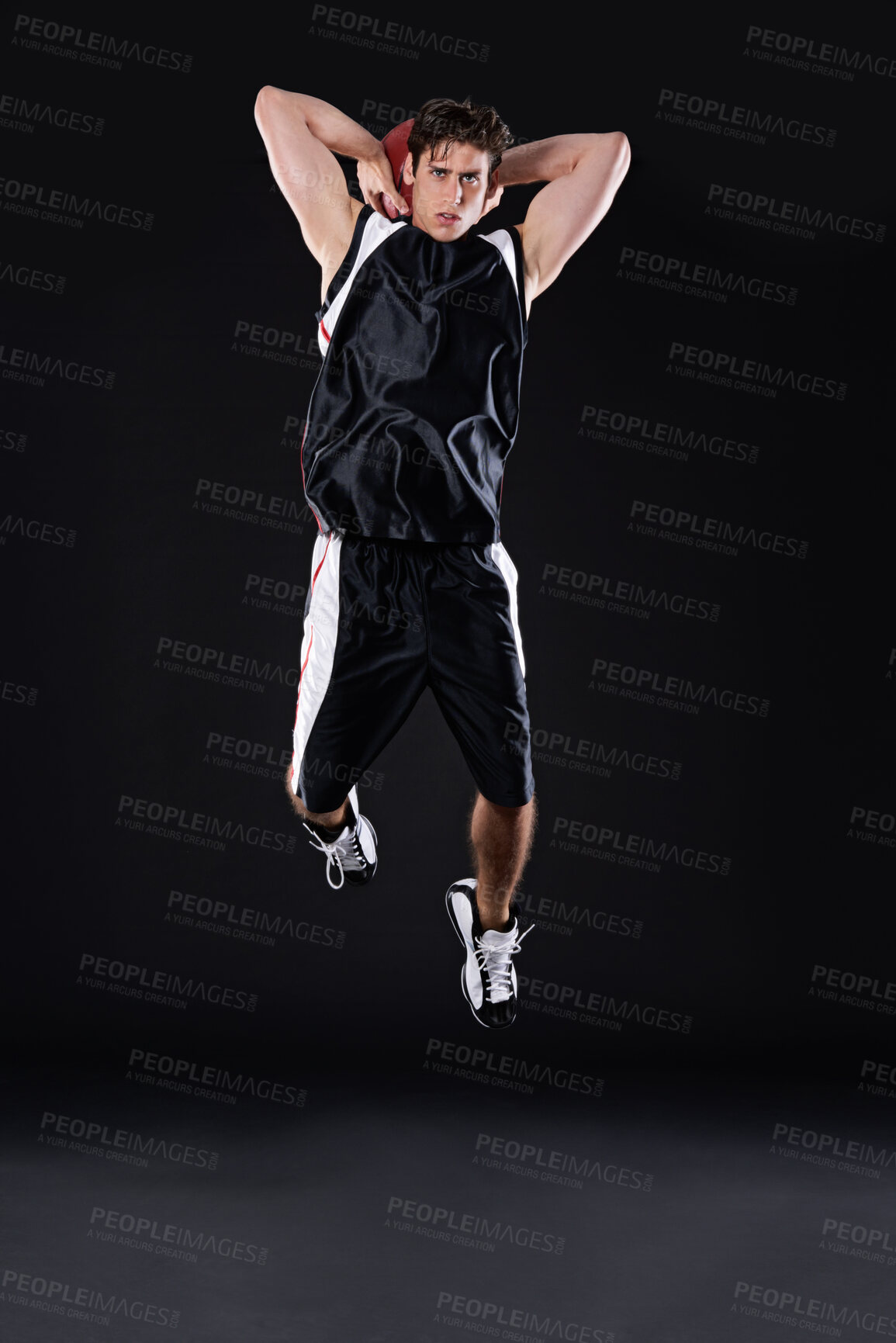 Buy stock photo Basketball, shooting and man jump in studio for training, energy and healthy body fitness isolated on black background. Sports, player and athlete dunk ball for competition, workout and mockup space