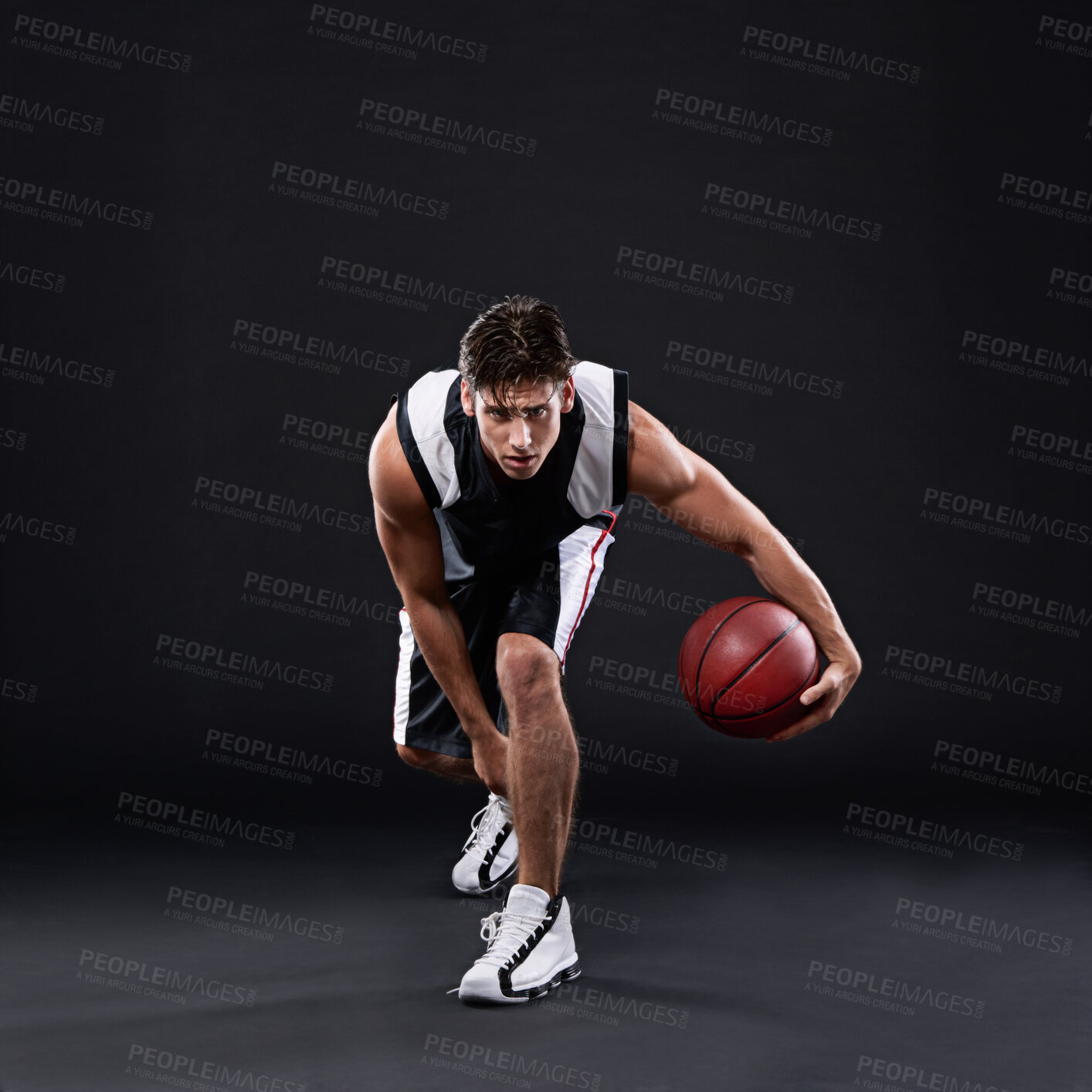 Buy stock photo Basketball, exercise and man dribble in studio for training, workout and healthy body fitness isolated on black background. Sports, player and athlete with ball for competition, game and mockup space