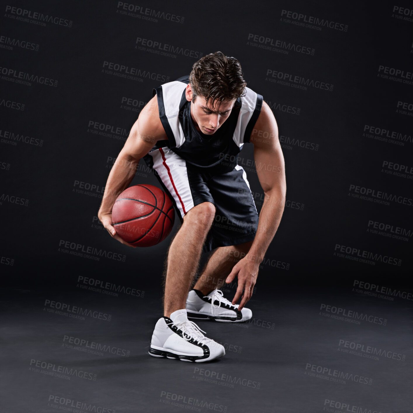 Buy stock photo Basketball, exercise and man dribble in studio for training, workout or healthy body fitness isolated on black background. Sports, player and athlete with ball for competition, action or mockup space