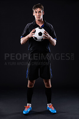 Buy stock photo Sports, soccer ball and man in portrait for training, fitness or practice as athlete or player in football. Male person, passion and game for exercise, wellness and goal on black background in studio