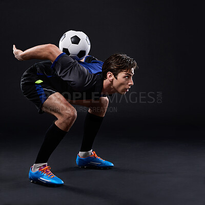 Buy stock photo Man, football and skill for fitness in studio for sports training with balance isolated on black background. Freestyle, talent and male athlete with control in soccer kit with exercise in Brazil.