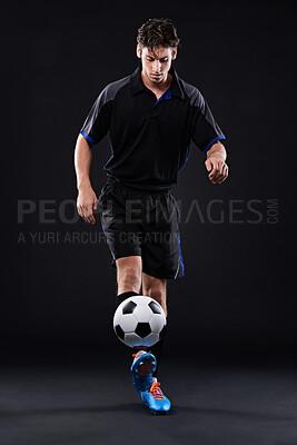 Buy stock photo Man, football and skill for fitness in studio for sports training with exercise isolated on black background. Talent, technique and juggling trick for freestyle in Brazil with control for practice.