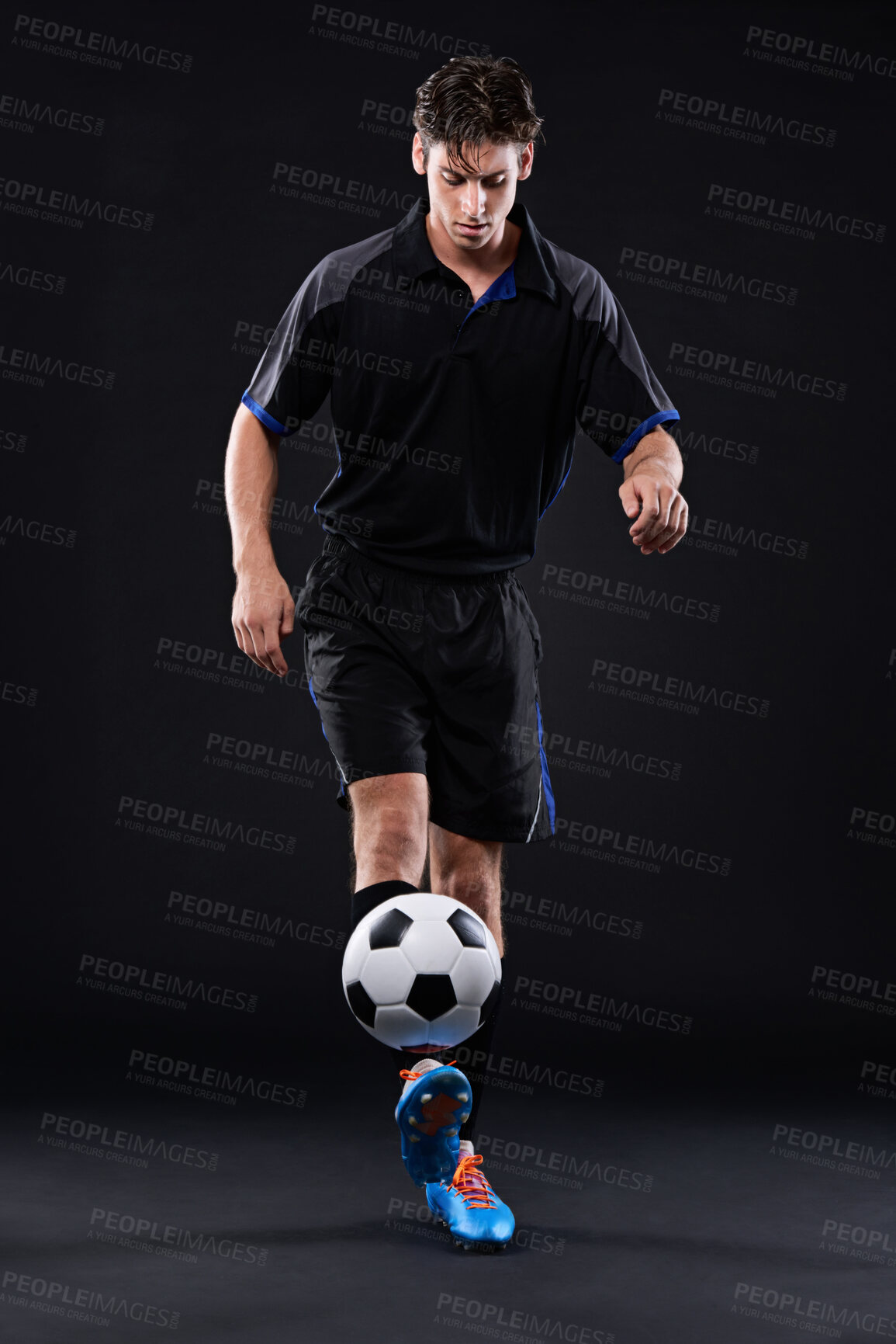 Buy stock photo Man, football and skill for fitness in studio for sports training with exercise isolated on black background. Talent, technique and juggling trick for freestyle in Brazil with control for practice.