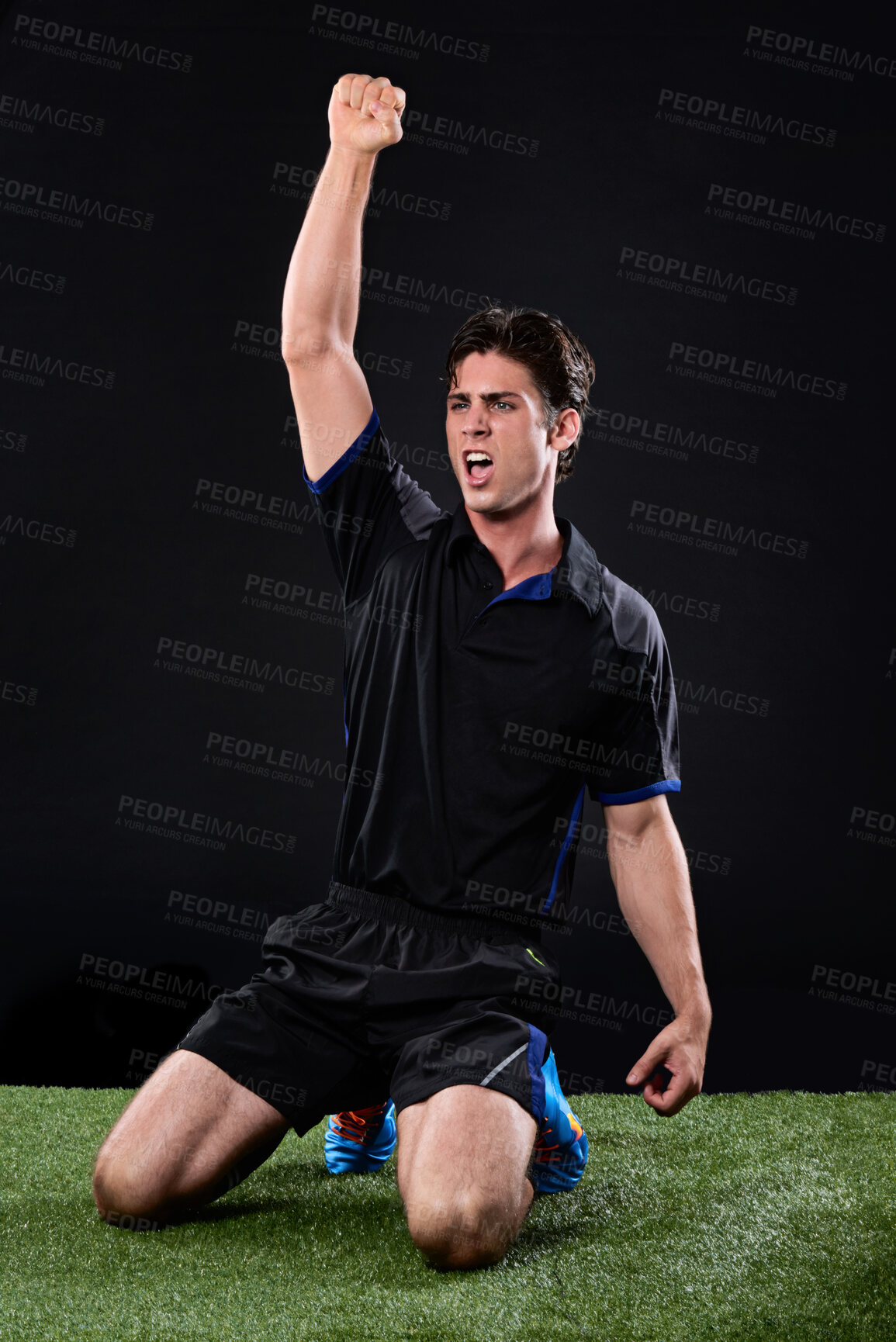 Buy stock photo Field, soccer player and man in grass, celebration and win in game, excited and cheering on ground and outdoor. Black background, happy and athlete with hands, fist or shouting of person and football