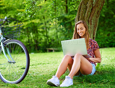 Buy stock photo Laptop, bicycle and woman on grass in park with smile, research and online education with internet. Studying, relax and happy girl with bike, computer and website for elearning on field in nature