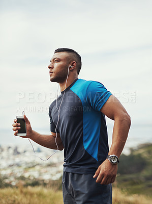 Buy stock photo Man, running and earphones in nature for fitness, smartphone and wellness training or marathon challenge or sport. Listening, music and motivation audio or radio for body health, outdoor and athlete