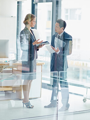 Buy stock photo Businesswoman, man and meeting in office with documents, technology or discussion for company growth. Female CEO, businessman and talking by window for strategy, updates or collaboration in workplace