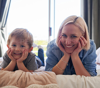 Buy stock photo Portrait, mother and son with smile or home, bed and happy for relax, bonding and family time. Holiday, parent and kid for happiness, lying and enjoy with adorable, bedroom and love or cheerful