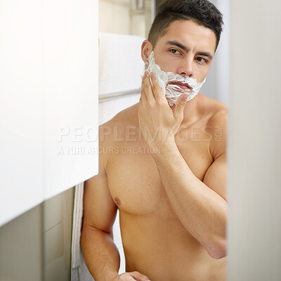 Buy stock photo Man, shaving cream and mirror in home bathroom for hygiene, cleaning and check face in morning. Person, cosmetics and topless in reflection, grooming and wellness with foam, change and self care