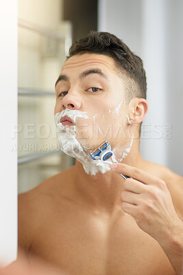 Buy stock photo Man, shaving and razor by mirror in bathroom for hygiene, cleaning or check face in morning at house. Person, cosmetics and topless in reflection, grooming or wellness with foam, change and self care