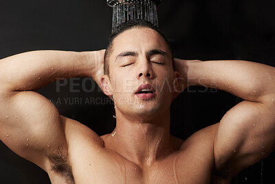 Buy stock photo Cleaning, relax and face of man in shower for muscle, body and wellness for skin routine in studio. Grooming, skincare and male model with wash, water and self care for confidence on black background