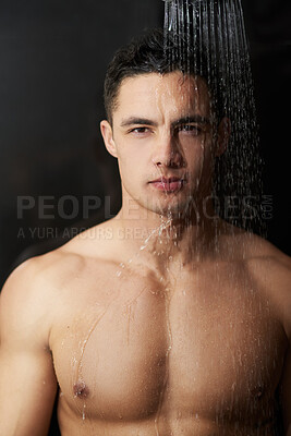 Buy stock photo Shower, water and man with portrait in studio with body cleaning, care and morning routine. Hygiene, wellness and skincare for dermatology and skin glow with washing, grooming and black background